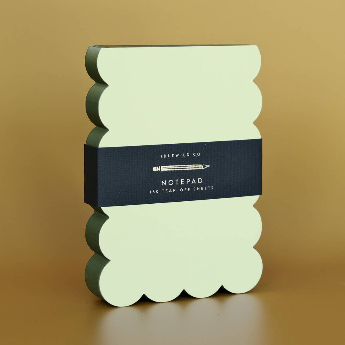 Idlewild Co. Scalloped Shaped Notepad in Chartreuse And Olive on a beige background at Addison West