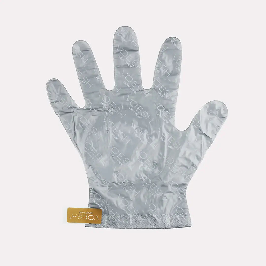 Collagen Gloves with Argan Oil & Floral Extracts on a pink background at Addison West