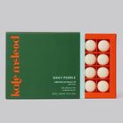 Daily Pebble | Deep Moisturizing Solid Bath & Shower Oil on a grey background at Addison West