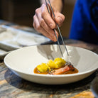 Made In 10" Entree Bowl on a table at Addison West