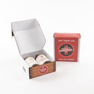 Hot toddy mix and mulling syrup in a 'Winter Survival Kit' packaging on a white background