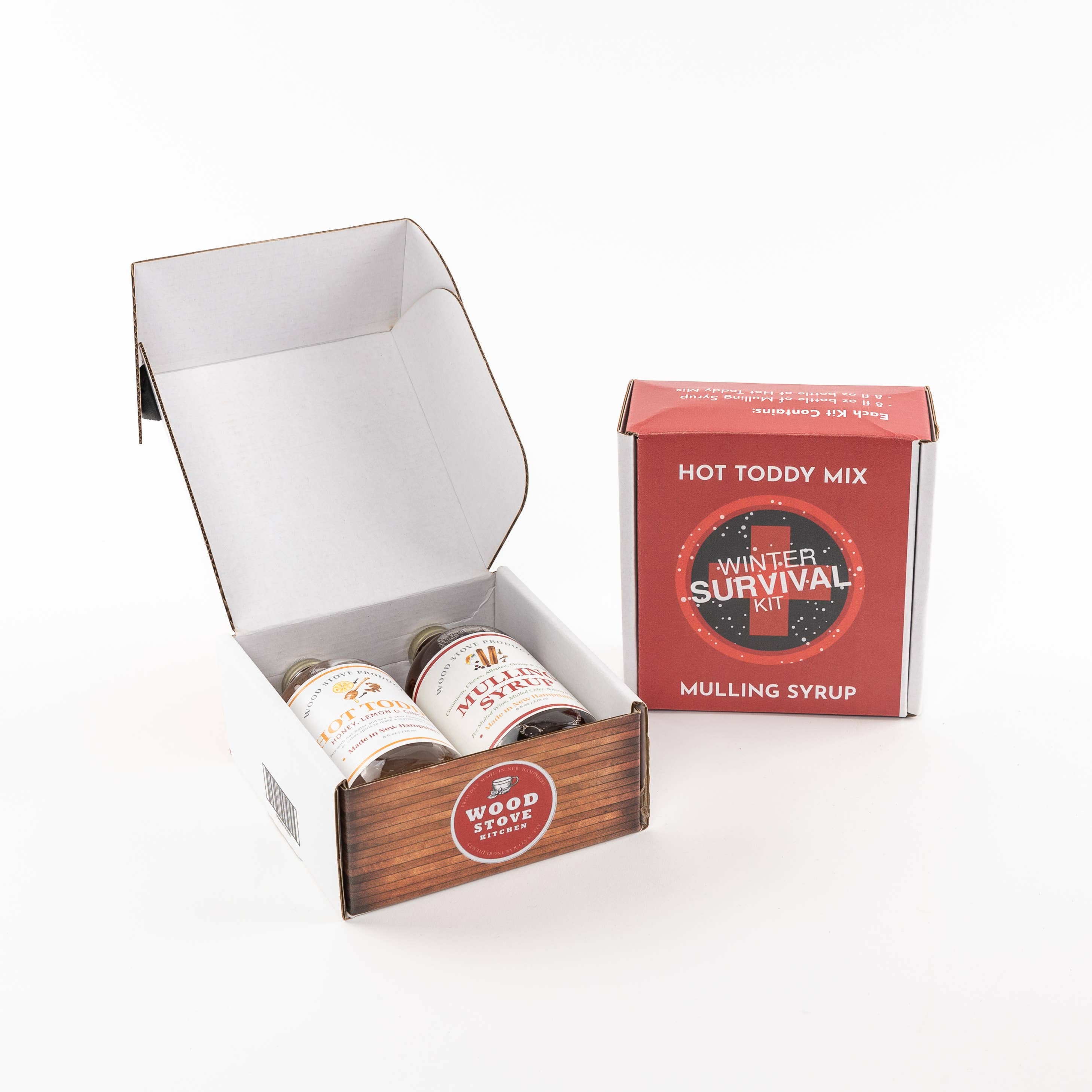 Hot toddy mix and mulling syrup in a 'Winter Survival Kit' packaging on a white background