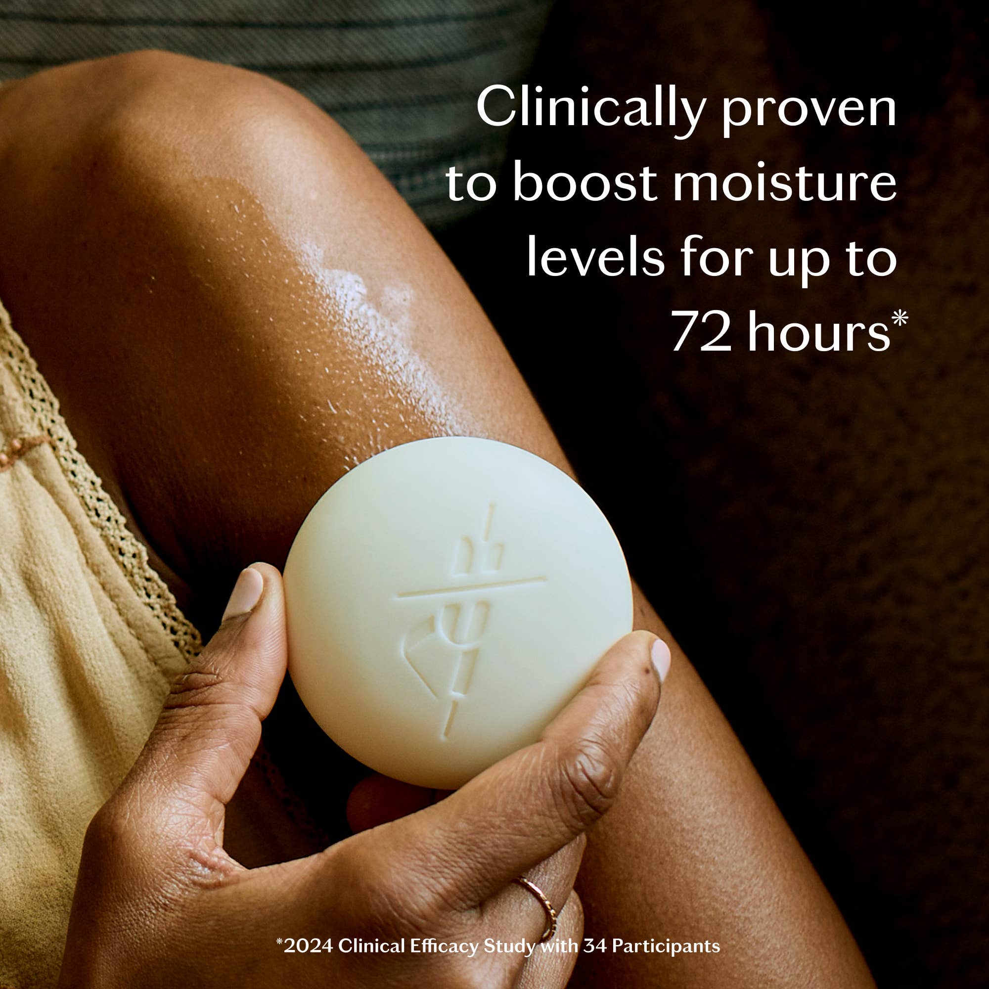 Tonka Bean & Coconut Deep Moisturizing Lotion Bar held by a model at Addison West