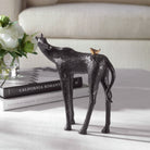 Horse and Bird Sculpture on a table at Addison West
