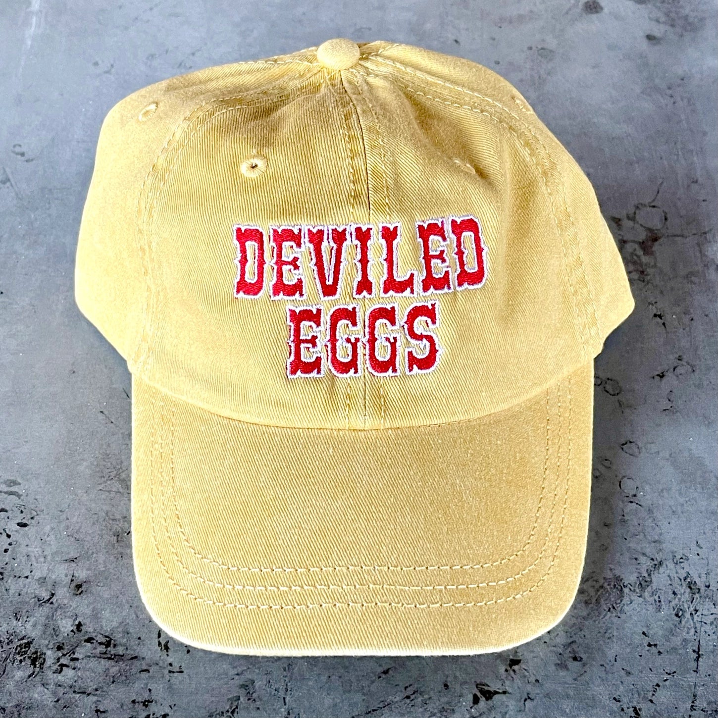 Deviled Eggs Baseball Hat on a grey background at Addison West