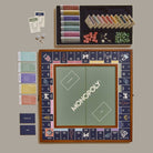 Monopoly Grand Folding Edition on a green background at Addison West