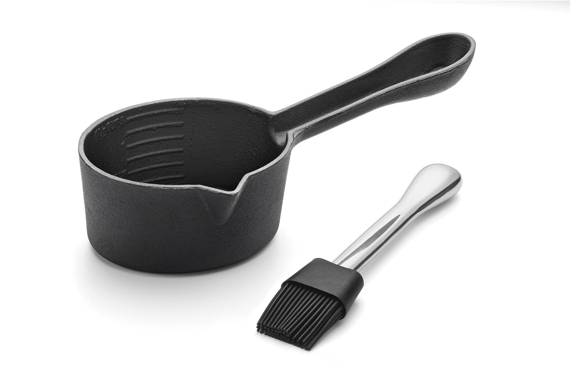 Black ladle and brush on a white background