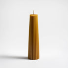 Greentree 8" Petite Pillar Candle in Natural on a white background at Addison West