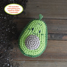 Crochet Your Veggies Avocado Amigurumi Kit on a wood table at Addison West