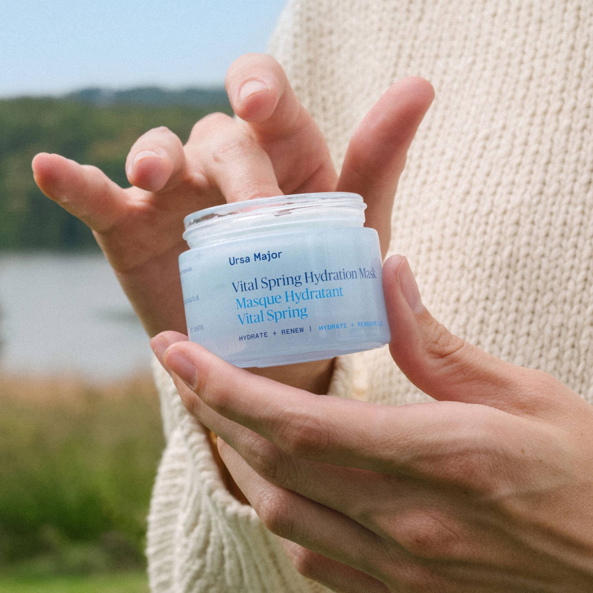 Vital Spring Hydration Mask held by a model at Addison West