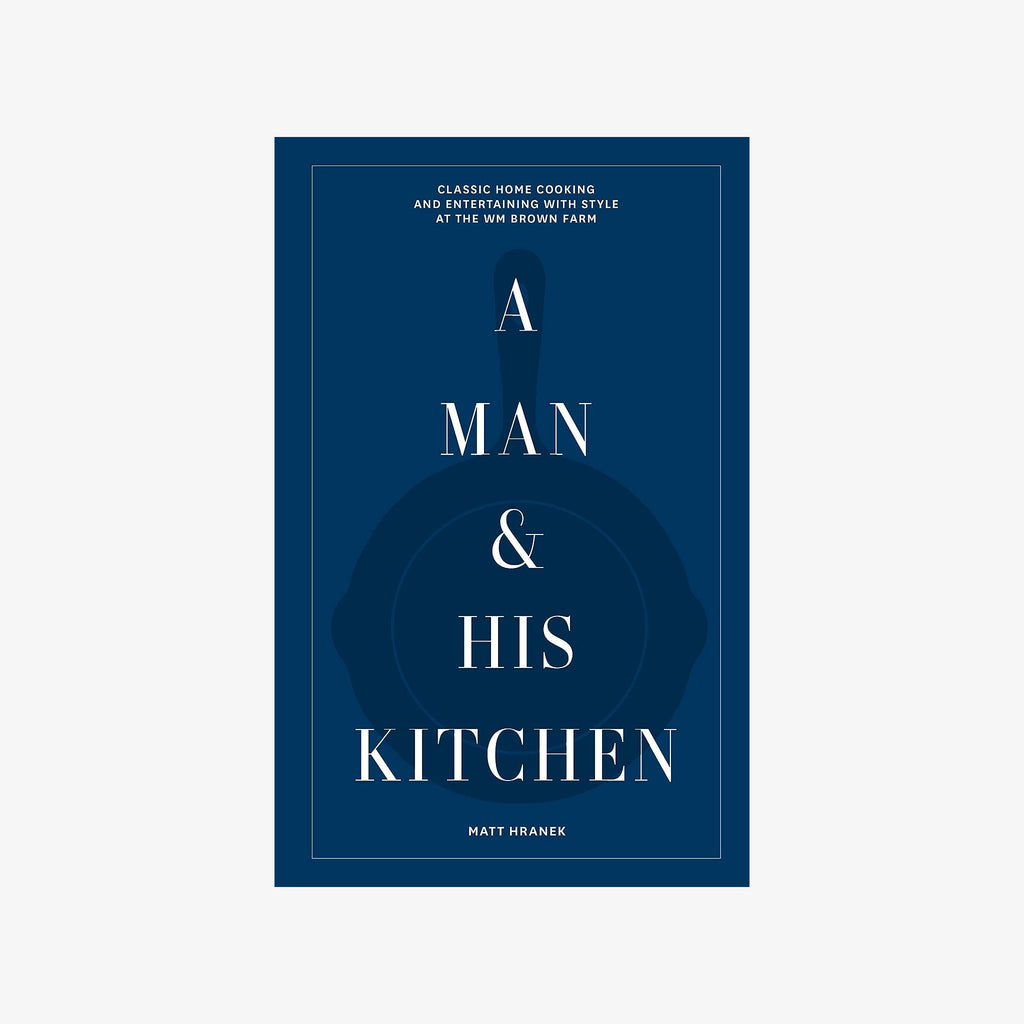 Blue front cover of book A Man & His Kitchen on a white background