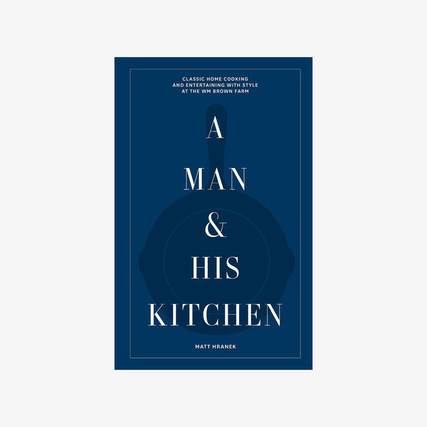 Blue front cover of book A Man & His Kitchen on a white background