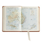The Traveler's Atlas Cognac Leather on white background at Addison West.
