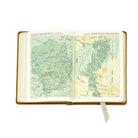 The Traveler's Atlas Green Leather on white background at Addison West.