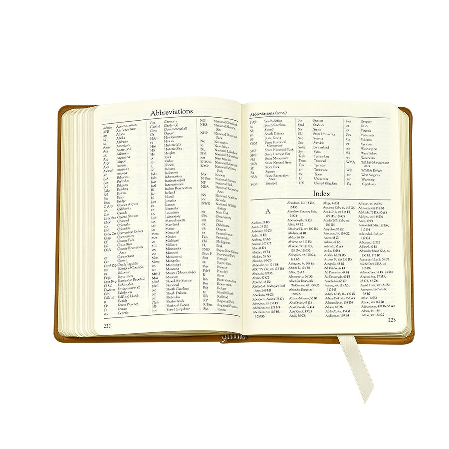 The Traveler's Atlas Green Leather on white background at Addison West.