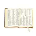 The Traveler's Atlas Cognac Leather on white background at Addison West.