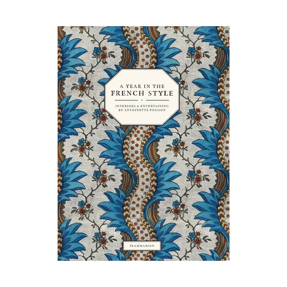 A book cover for 'A Year in the French Style: Interiors & Entertaining by Anthony Poelge' featuring a detailed botanical pattern in blue, brown, and beige, with a cream-colored title label.