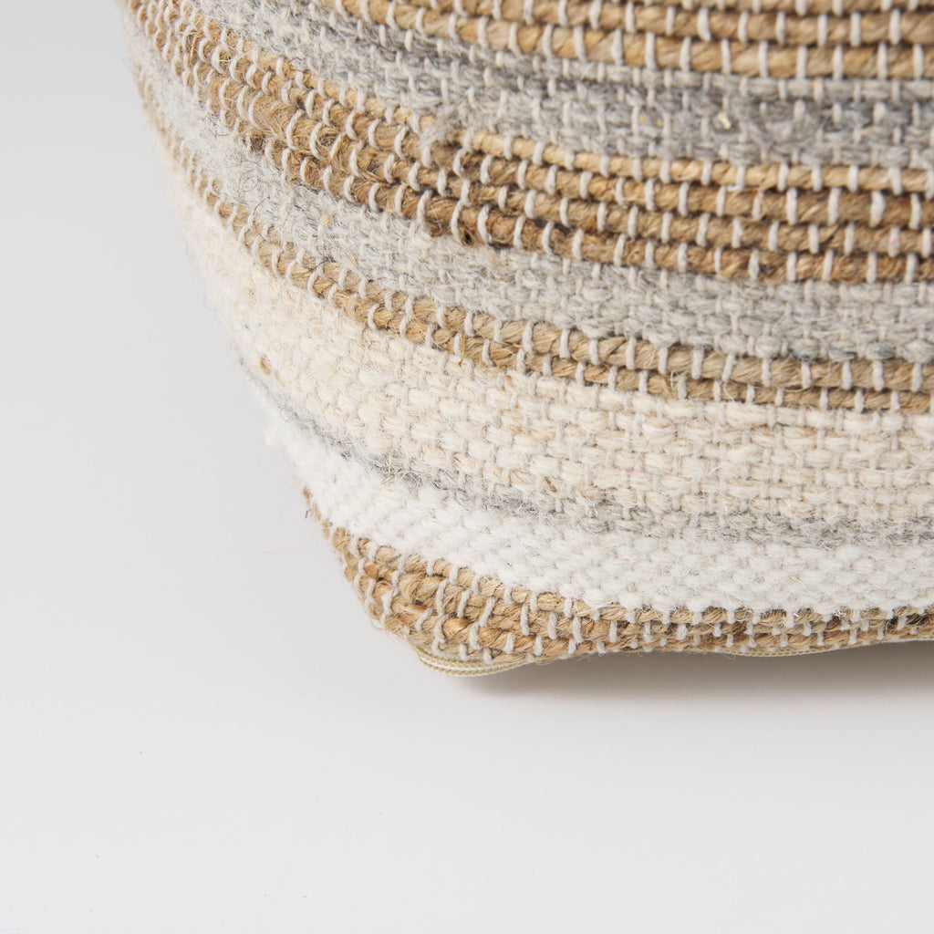 Close up of Aahana White/Taupe/Gray Striped Hemp and Cotton Pouf on a white background