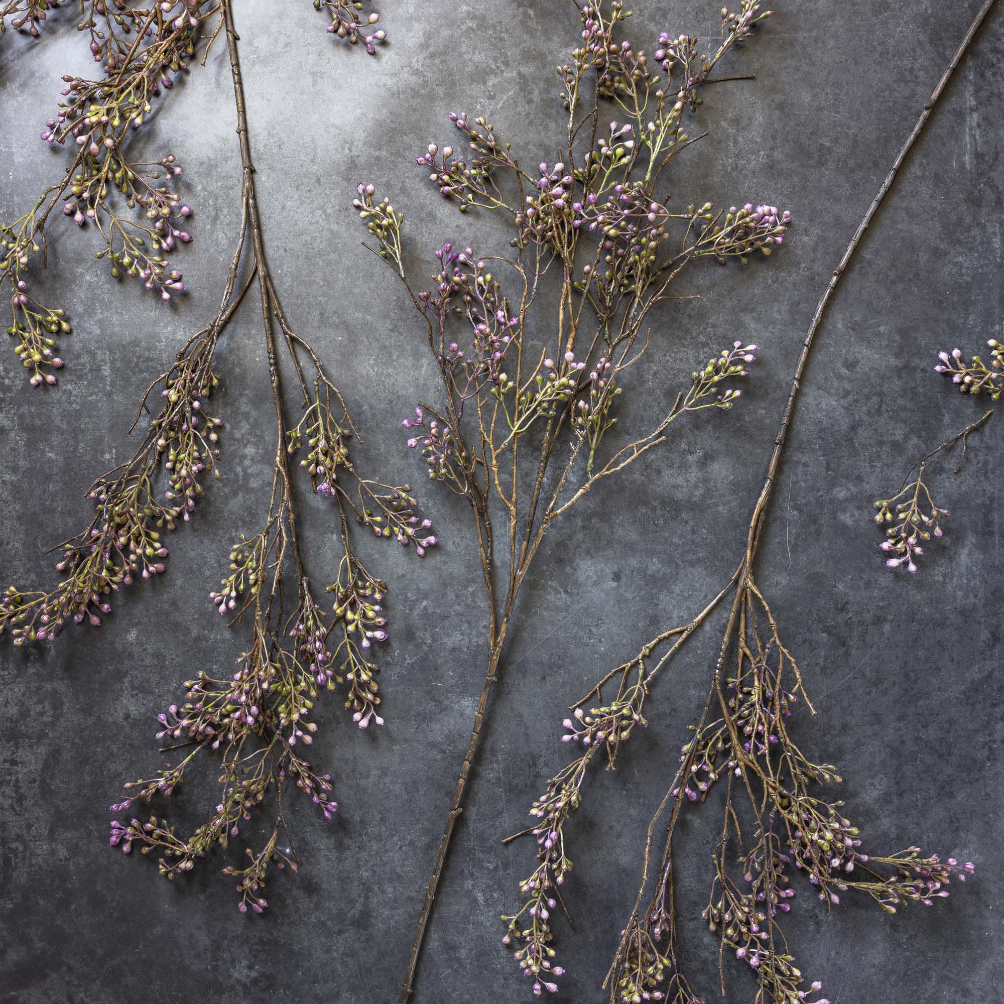 Abigail Ahern Artificial Berry Branch in Lilac on a grey background at Addison West