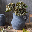 Abigail Ahern Faux Hydrangea, Chloris on a wood table at Addison West