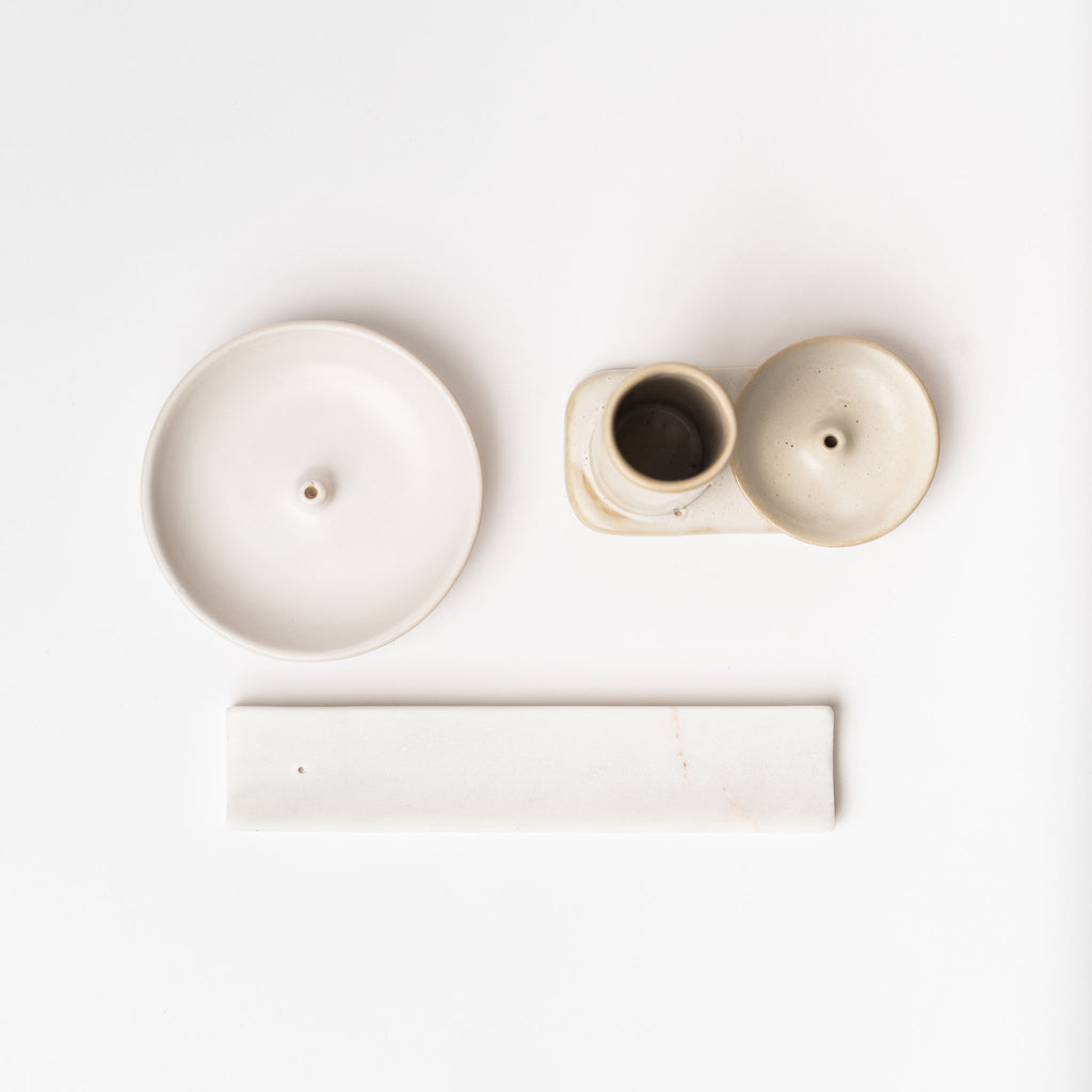 Various white  incense holders on a white background
