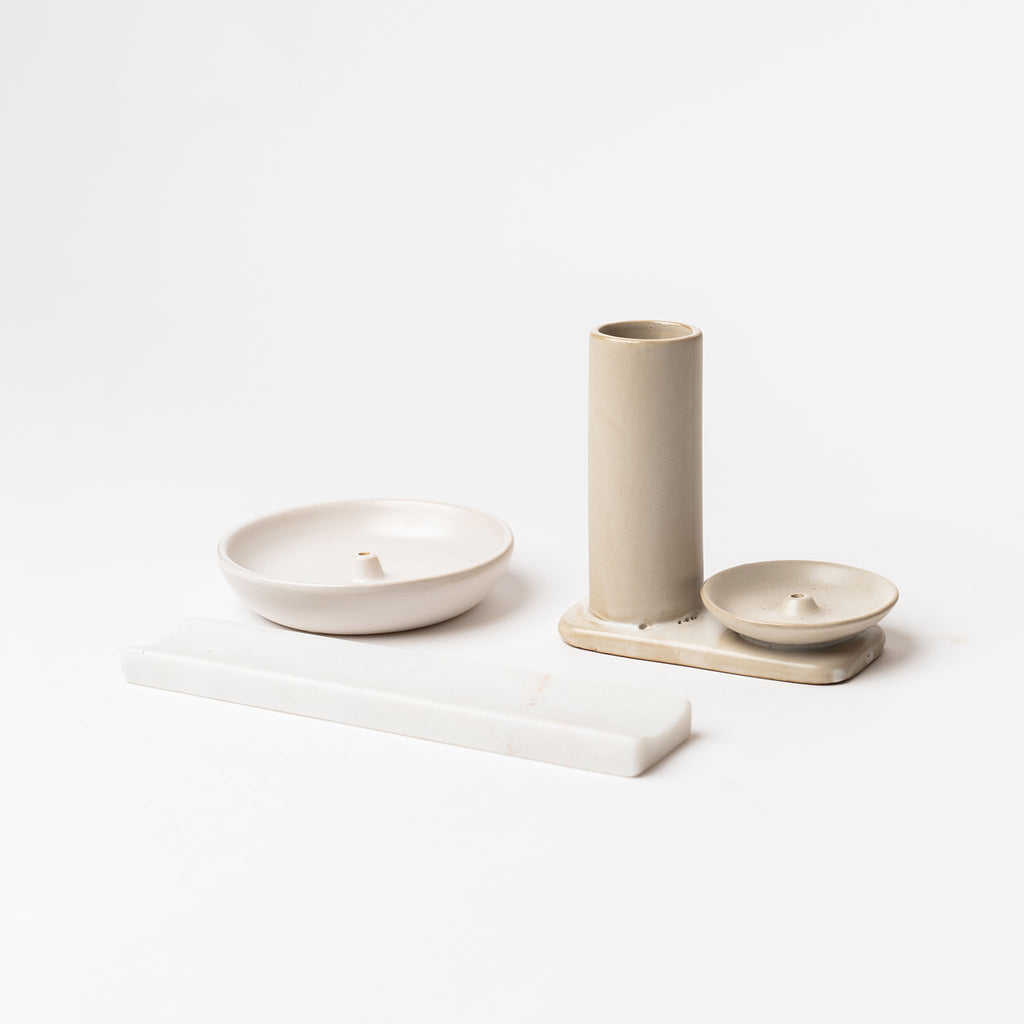 Various white  incense holders on a white background