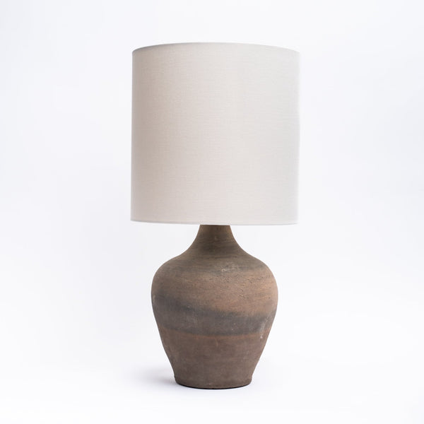 Vintage clay pot in earthen, unglazed rice wine bottle table lamp from Addison West home goods on a white background
