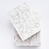 Top of mother of pearl inlay boxes in two sizes stacked on a white background from above from Addison West home goods