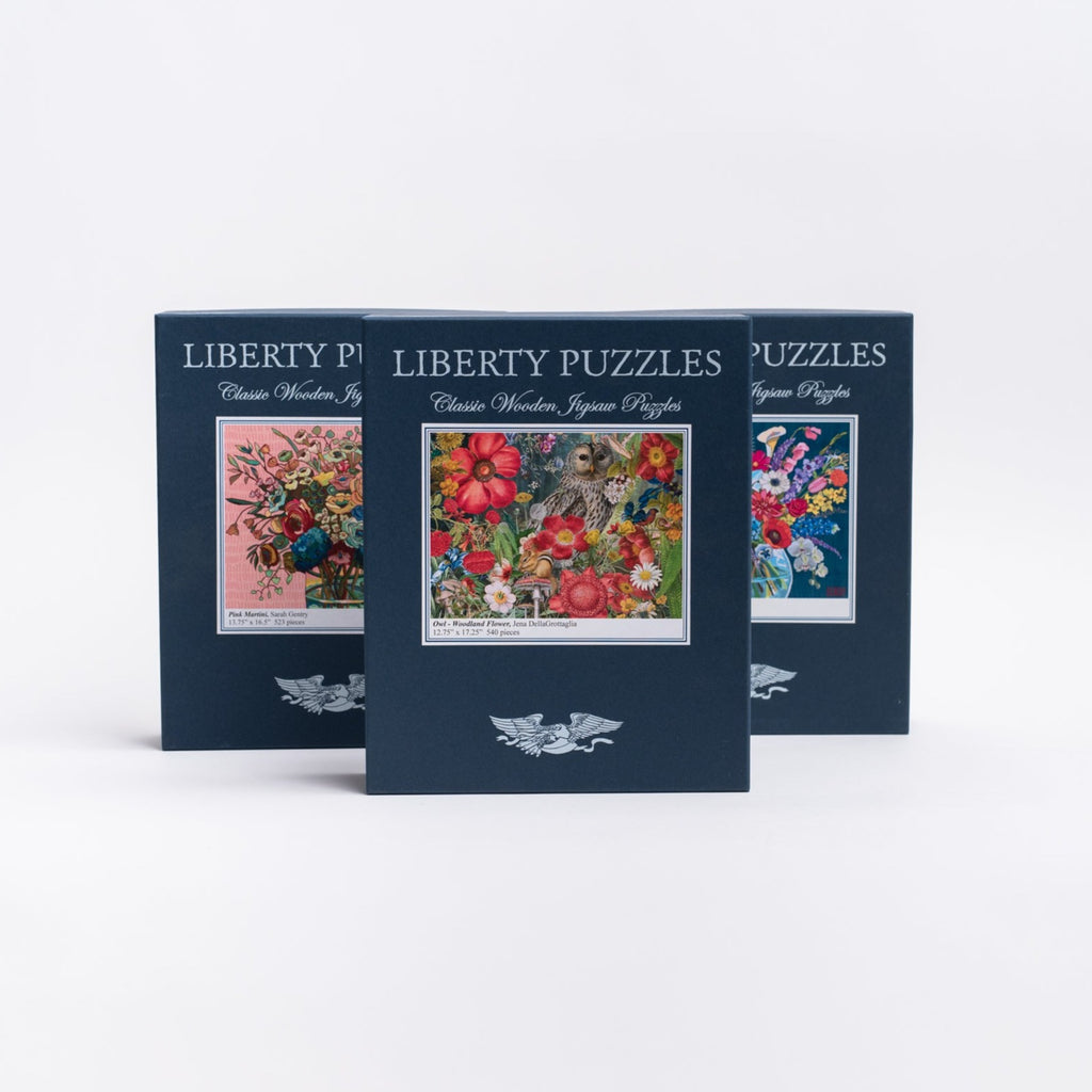 Three Liberty Puzzles boxes on a white background