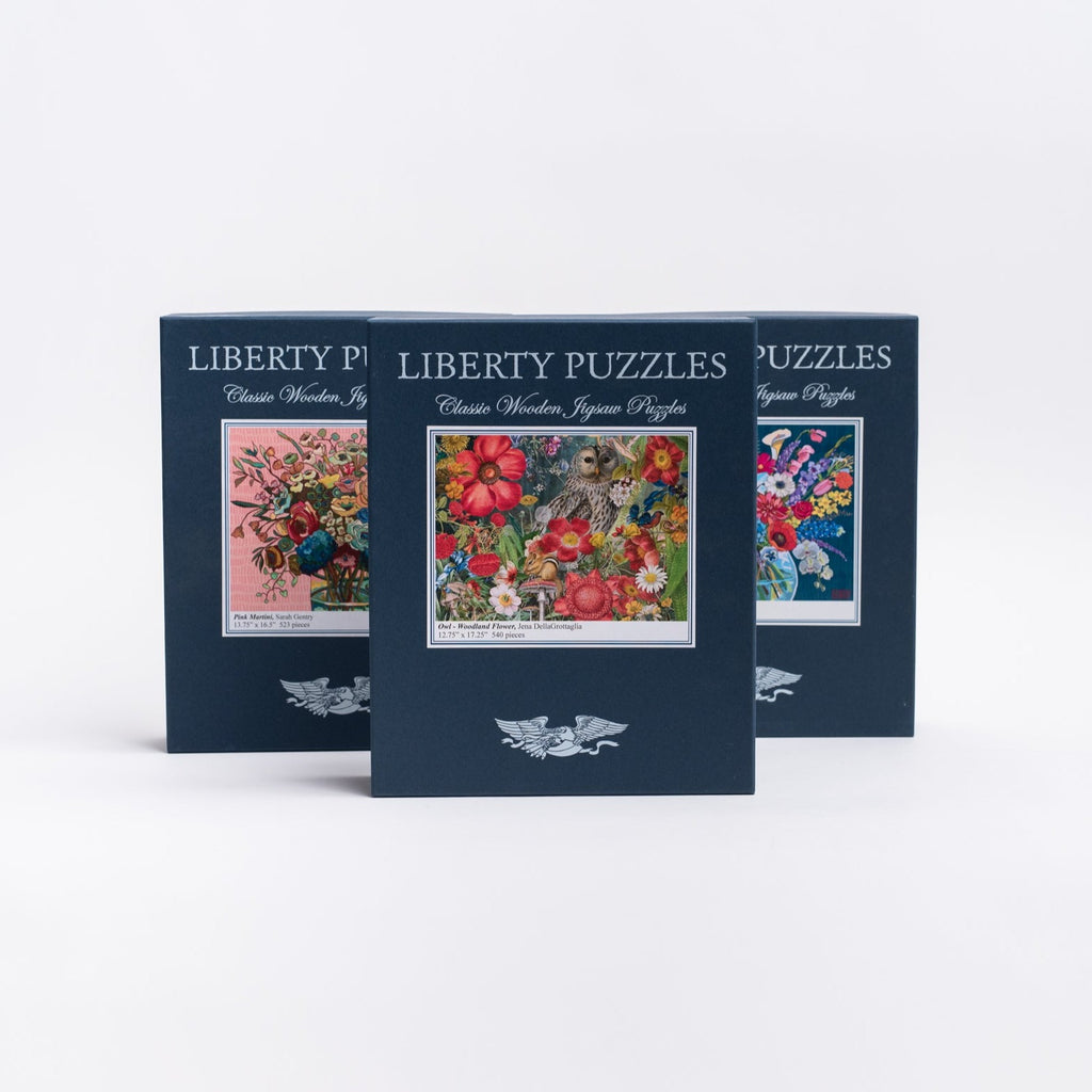 Three Liberty Puzzles boxes on a white background