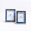 Set of two Zodax Capri Blue and white picture frames on a white background