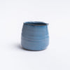 Small blue planter pot on a white background