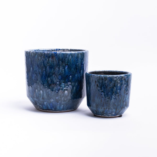 Small and large Indigo planter with reactive glaze on a white background