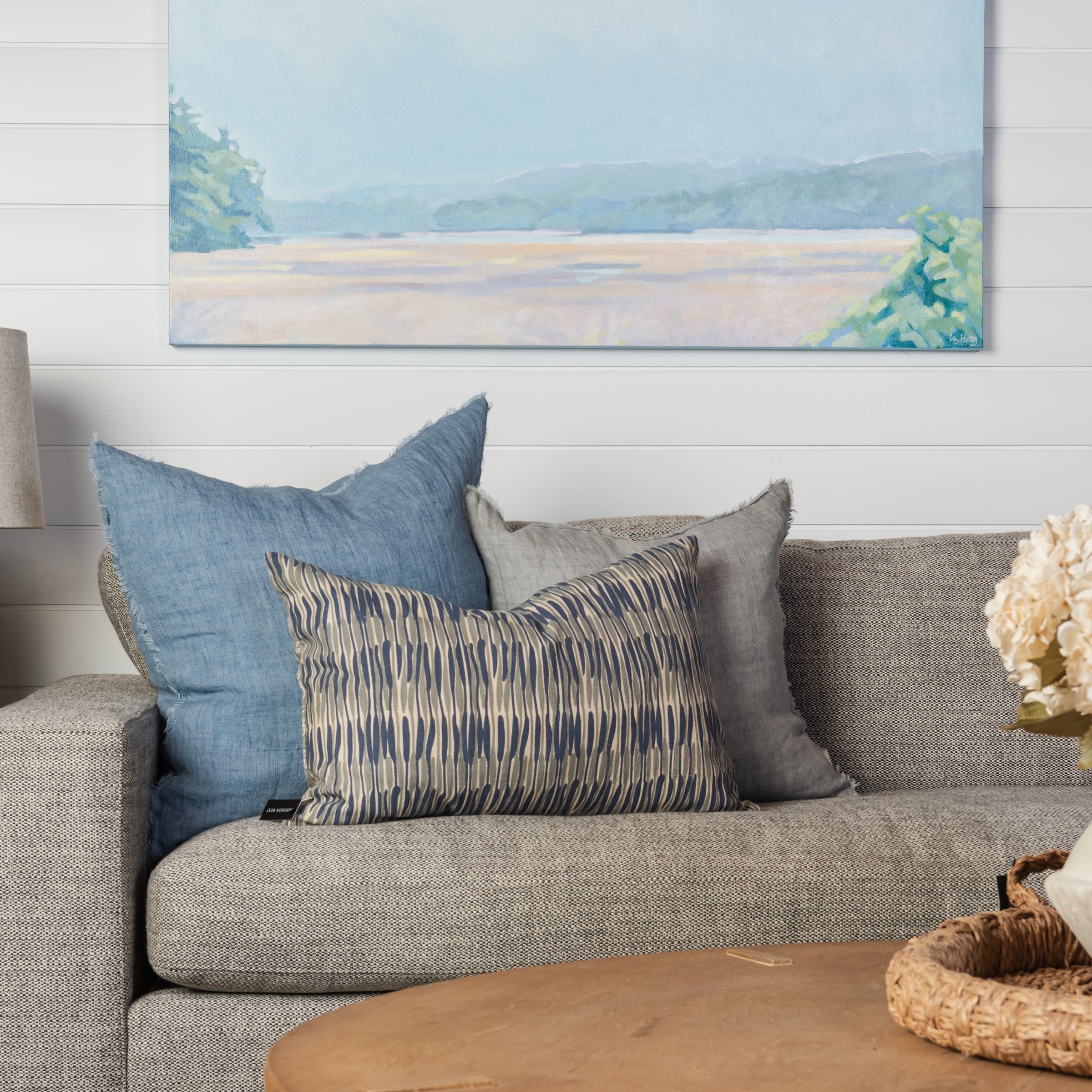 Waves & Florals Double Sided Lumbar Pillow on a beige sofa at Addison West