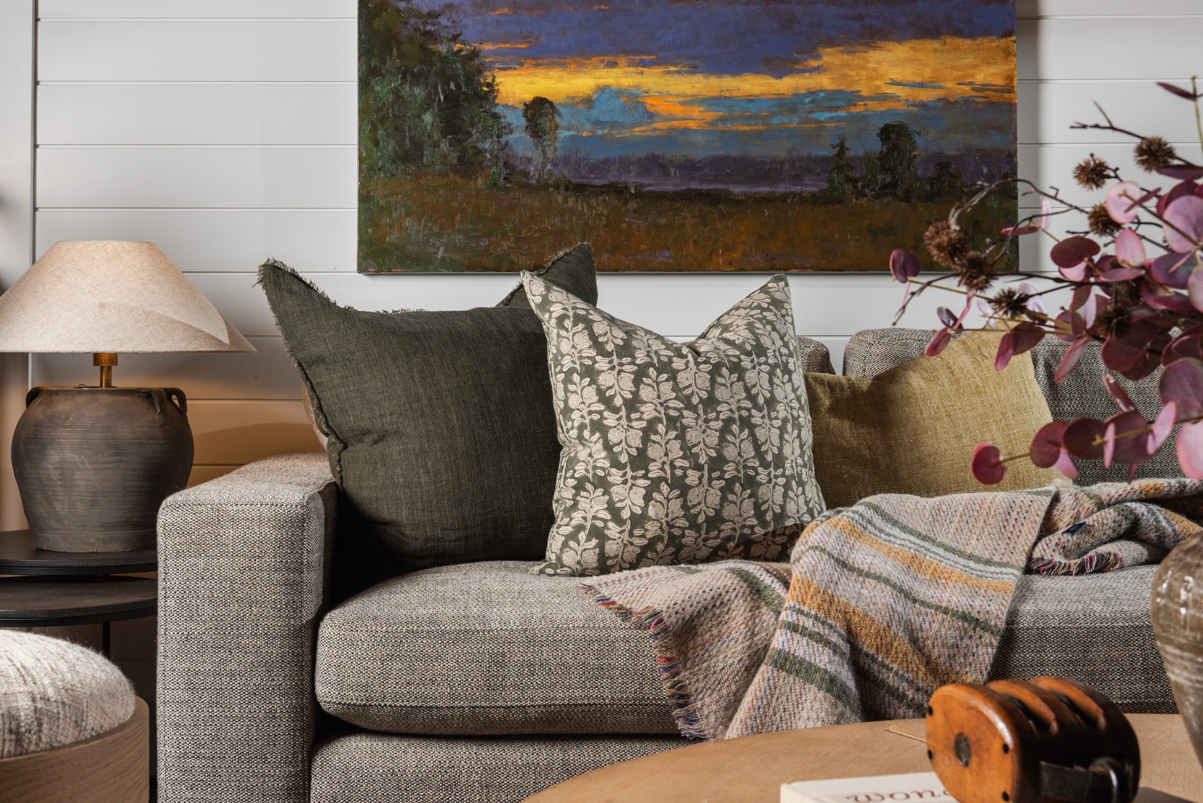 Cozy fall and winter throw pillows on a sofa at Addison West