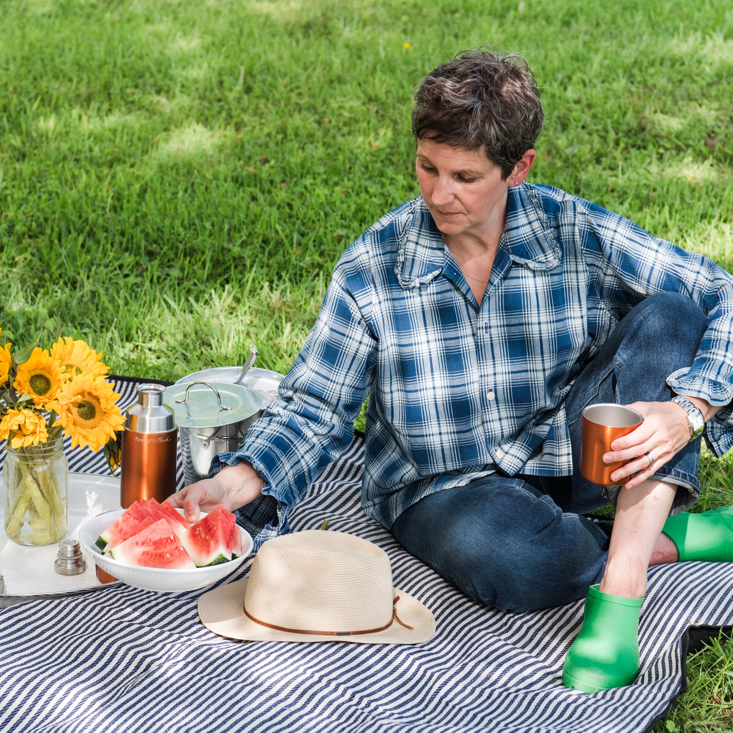 Wayfaring Waterproof Picnic Blanket with a model at Addison West