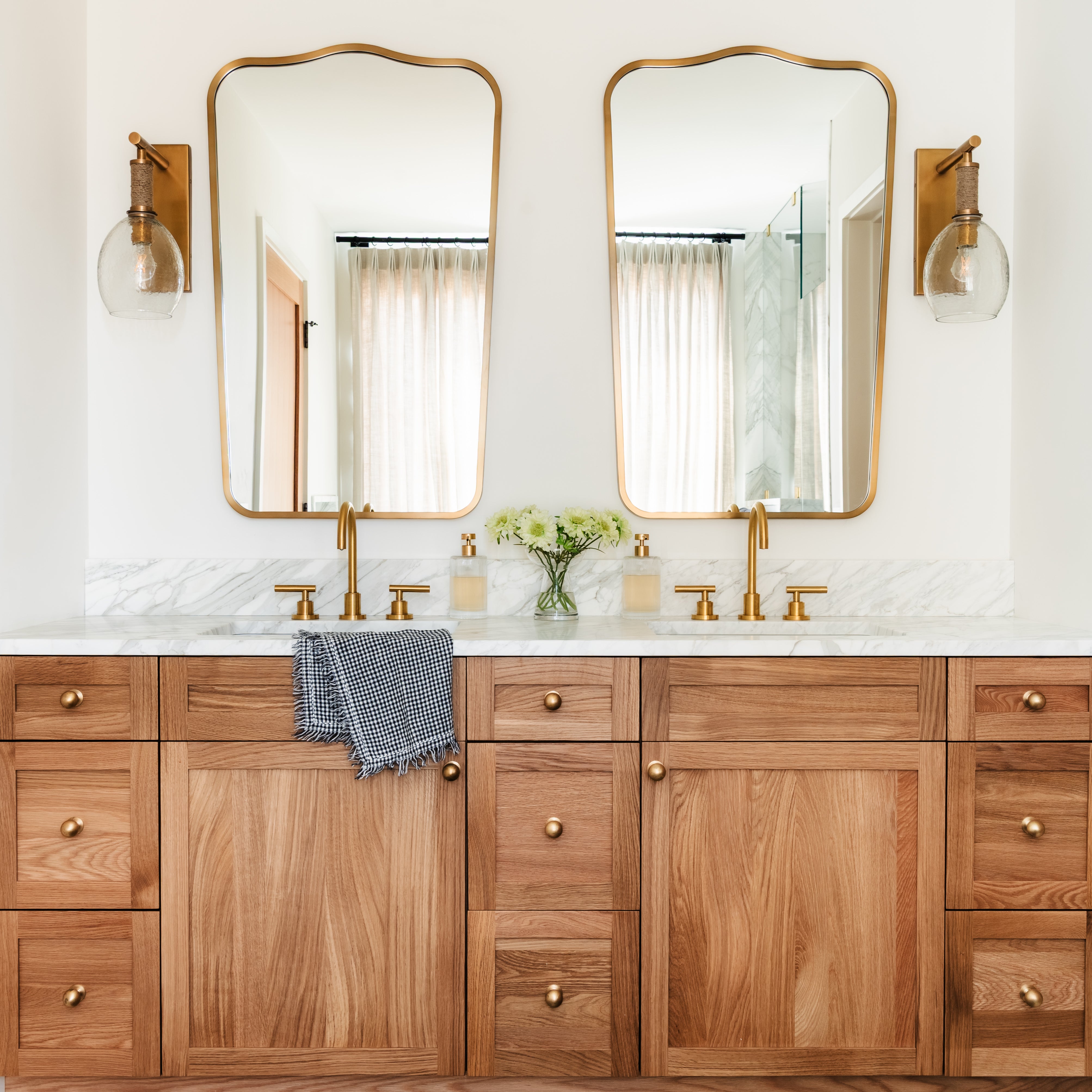 Palecek Bronson Sconce In Brass in a bathroom at Addison West