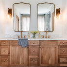 Palecek Bronson Sconce In Brass in a bathroom at Addison West