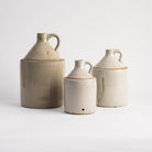 Vintage ceramic Crocks on a white background at Addison West