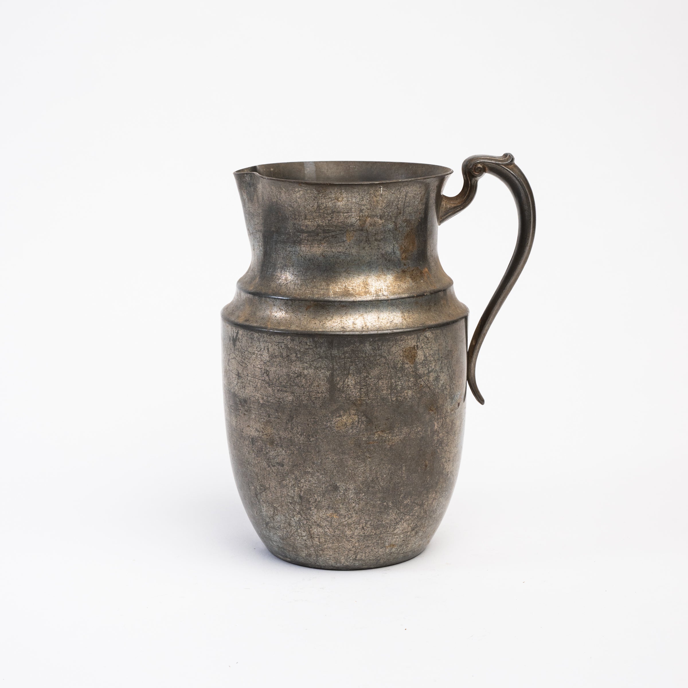 Vintage Pewter Pitcher on a white background at Addison West