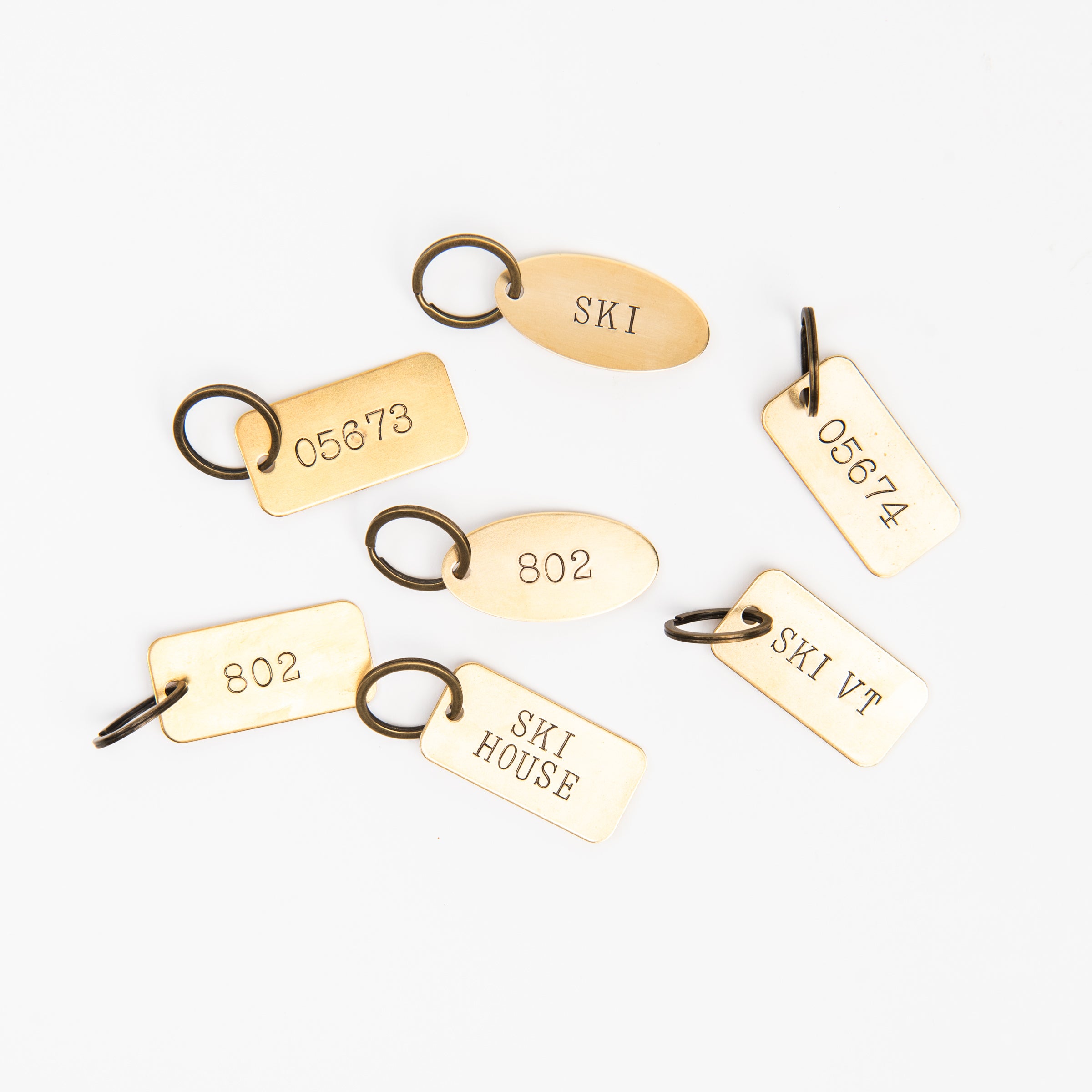 Brass keyrings at Addison West on a white background at Addison West
