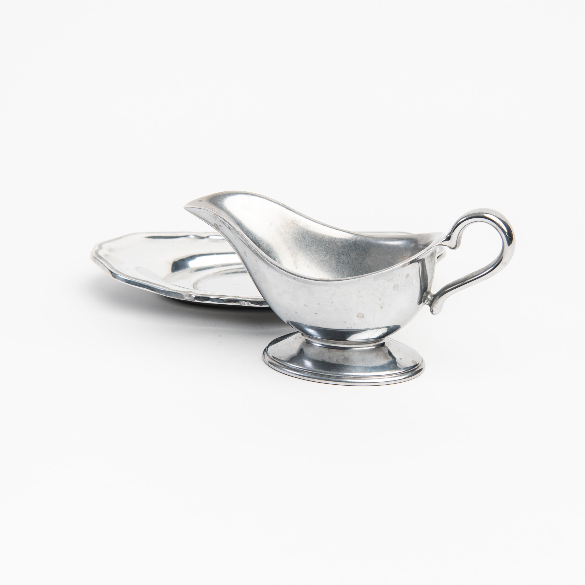 Vintage Wilton Pewter Gravy Boat on a white background at Addison West