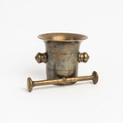 Vintage European Brass Mortar and Pestle c. 1780-1850 on a white background at Addison West