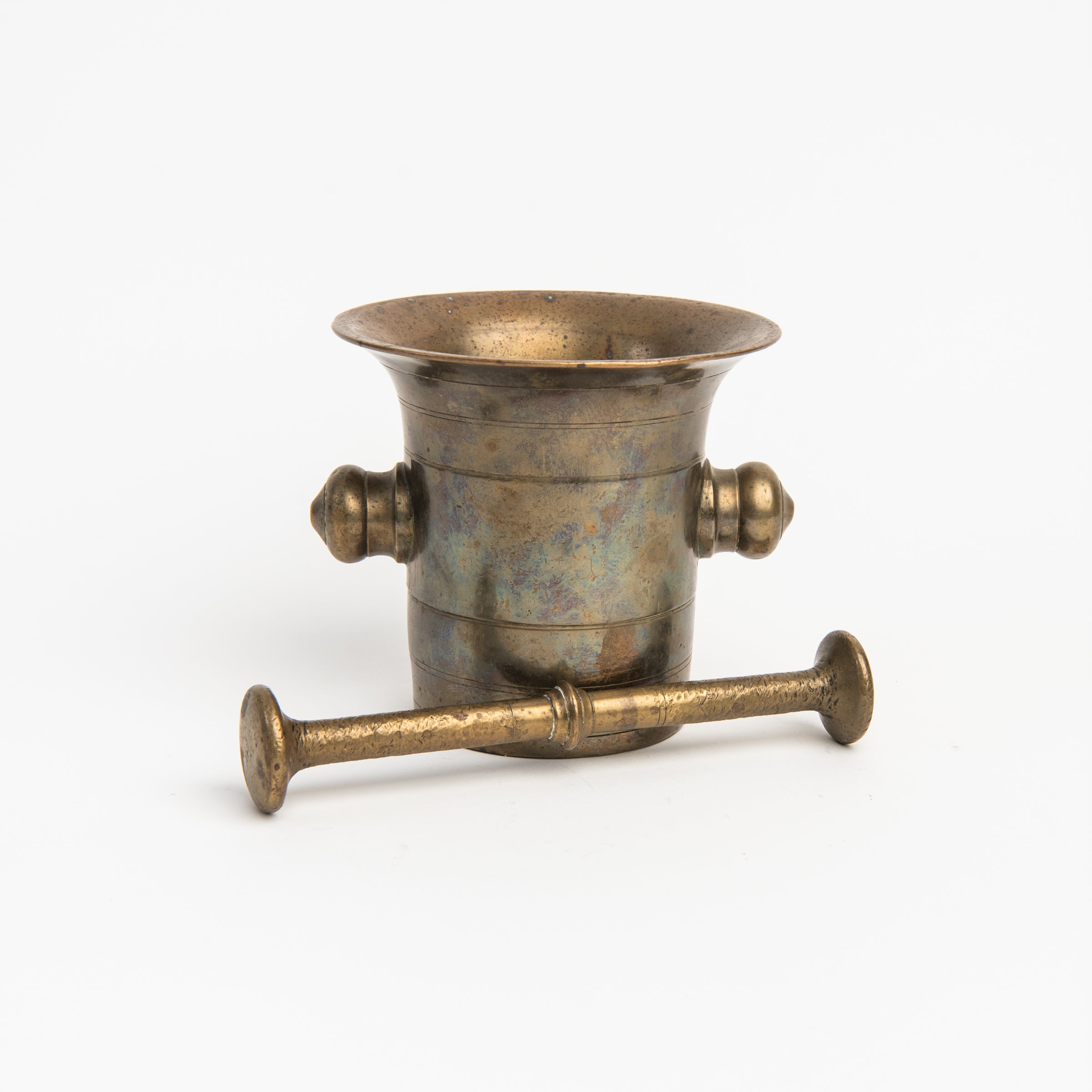 Vintage European Brass Mortar and Pestle c. 1780-1850 on a white background at Addison West