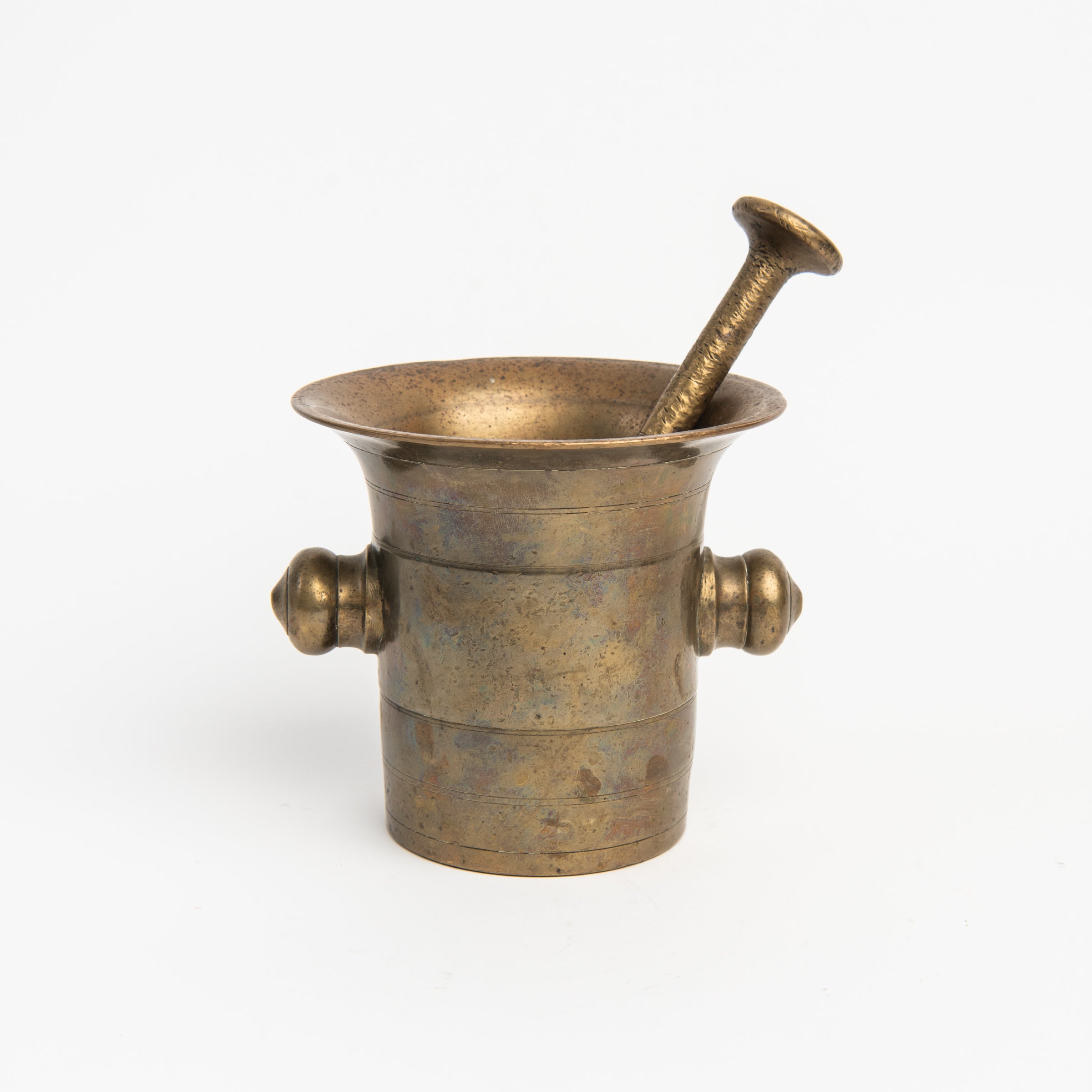 Vintage European Brass Mortar and Pestle c. 1780-1850 on a white background at Addison West