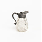 Vintage Victorian Ornate Syrup Pitcher on a white background at Addison West