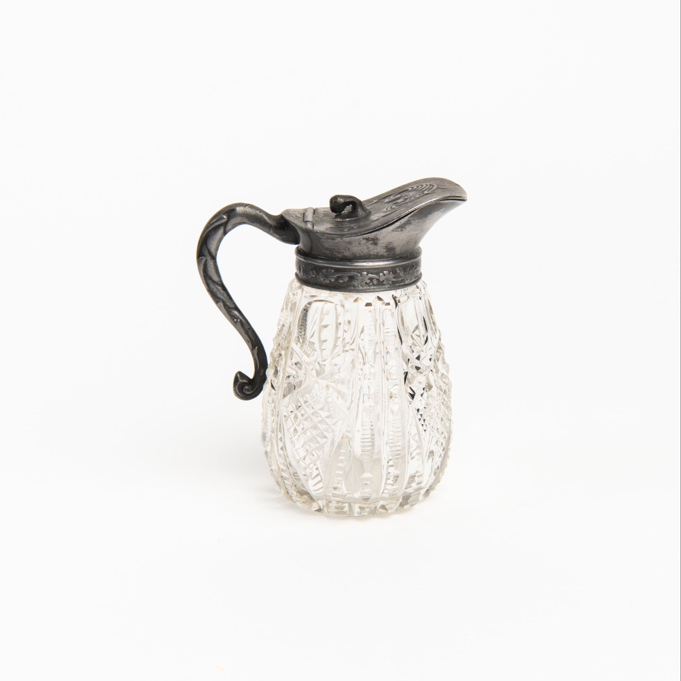Vintage Victorian Ornate Syrup Pitcher on a white background at Addison West