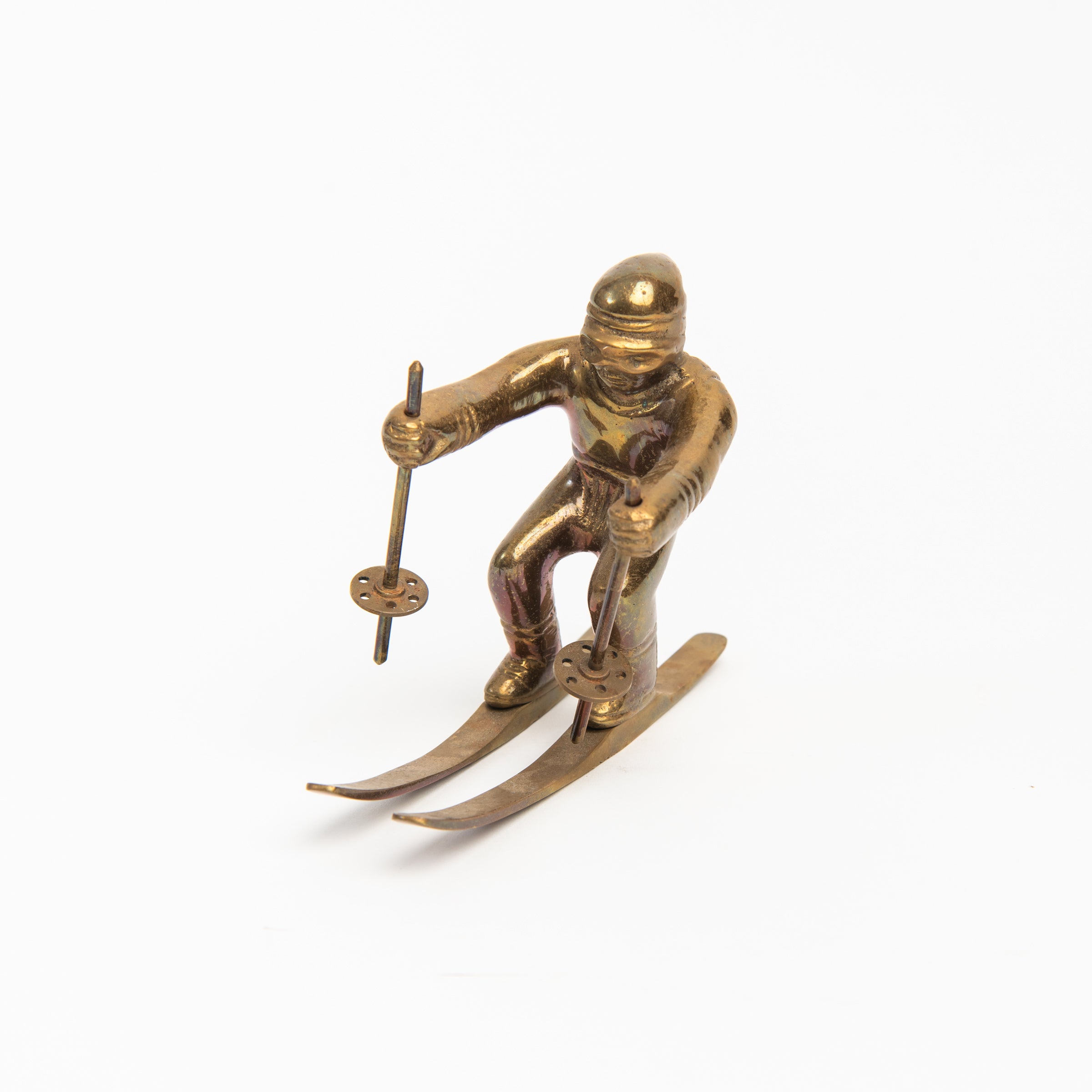 Vintage Brass Skier on a white background at Addison West