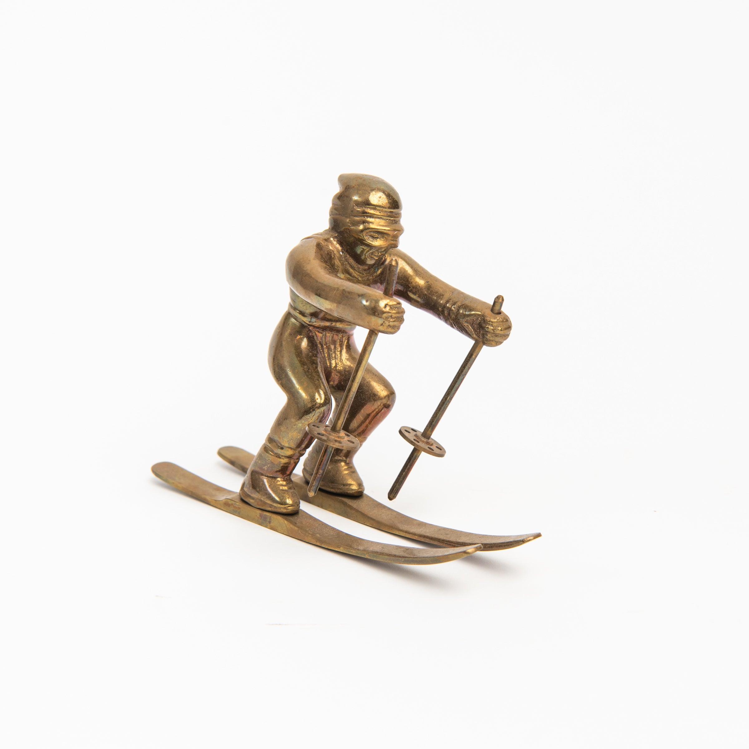 Vintage Brass Skier on a white background at Addison West
