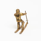 Vintage Brass Skier on a white background at Addison West